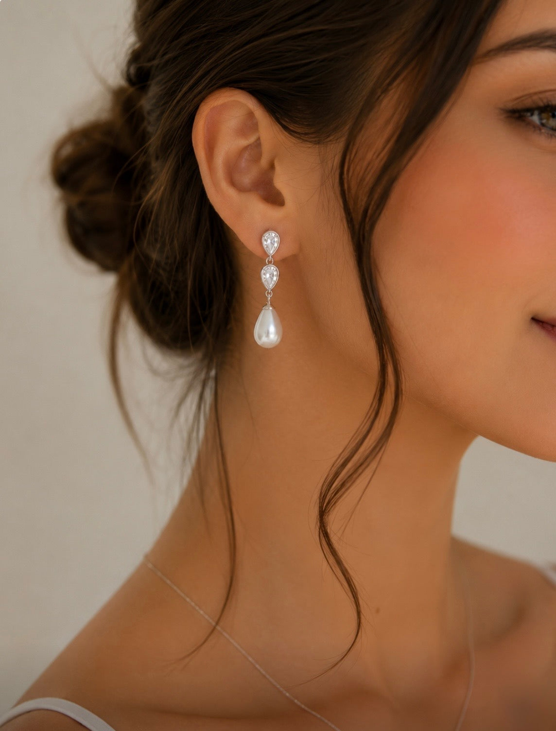 Wedding drop earrings with natural freshwater pearls and cubic zirconia.